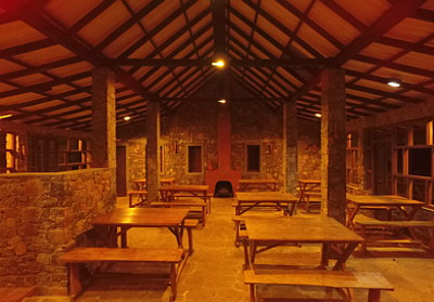 corberts restaurant tables, fireplace, rock stone dinnning area